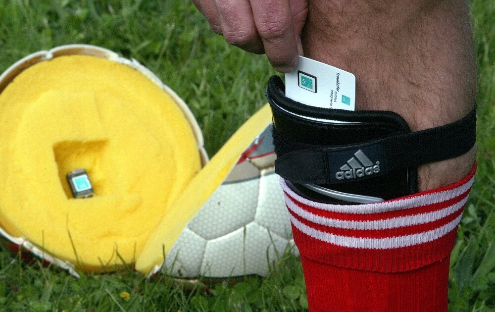A football player tests a new high tech system for soccer that has a microchip built into