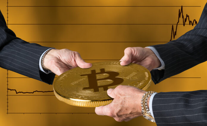 Hands of three financial traders gripping bitcoin against a background of rising prices for the currency