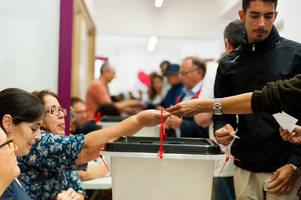 people voting during illegal referendum for catalan indepedence