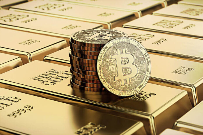 Bitcoin laying on stacked gold bars gold ingots bars