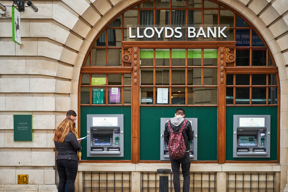 People at Lloyds bank atm, cash dispenser