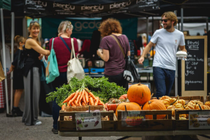 people shopping at Brockley Market, a local farmer's market held every Saturday in Lewisham