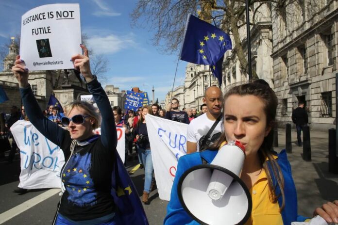 angry demonstrators march on Westminster in protest against Brexit and the Brexit process