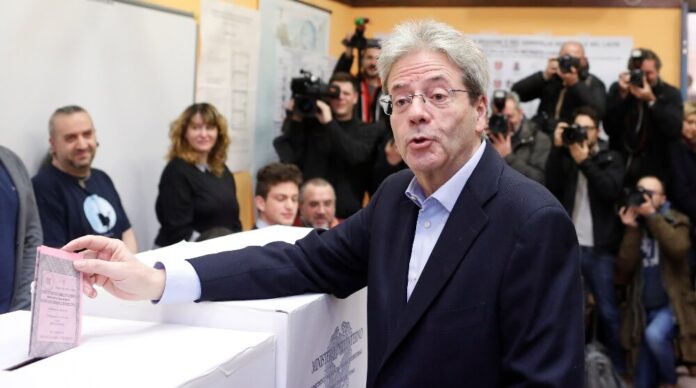 Italian Prime Minister Paolo Gentiloni casts his vote at a polling station in Rome