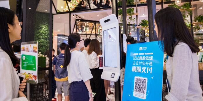 A customer tries Alipays facial recognition payment solution Smile to Pay at KFCs new KPRO restaurant in Hangzhou Zhejiang province