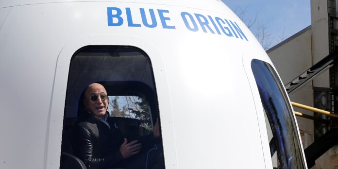 Amazon and Blue Origin founder Jeff Bezos addresses the media about the New Shepard rocket booster and Crew Capsule mockup at the 33rd Space Symposium in Colorado Springs.