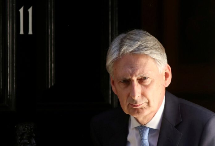 Britain's Chancellor of the Exchequer Philip Hammond leaves 11 Downing Street in London. Image: REUTERS/Simon Dawson